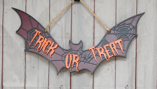 Trick or Treat bat-shaped door hanger